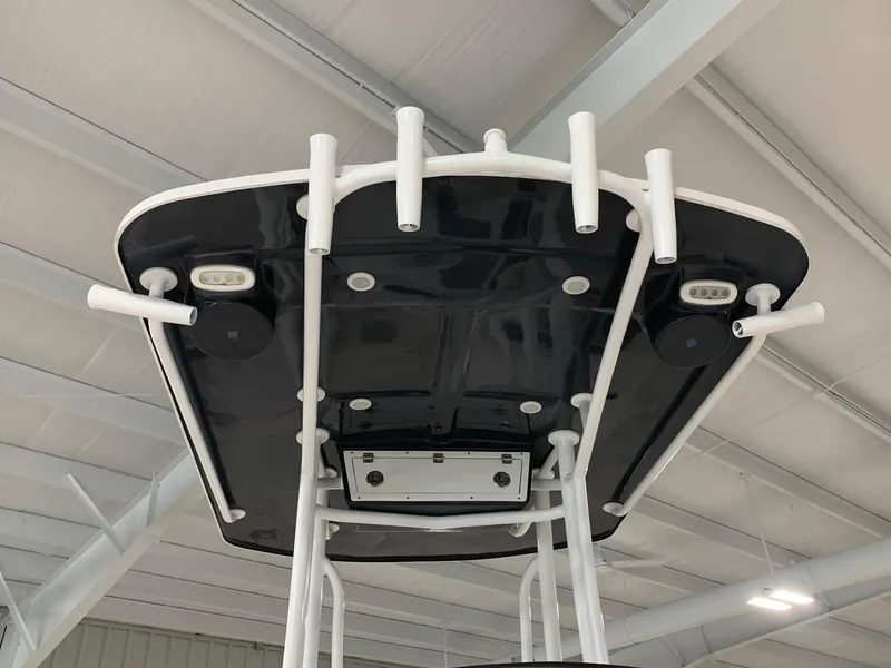 Slide: The Image of 2024 Robalo 246 Cayman T-top with rod holders and LED lights. - 6