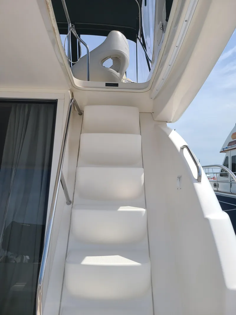 Slide: The Image of Staircase on a 2004 Meridian 341 Sedan yacht leading to upper deck. - 10