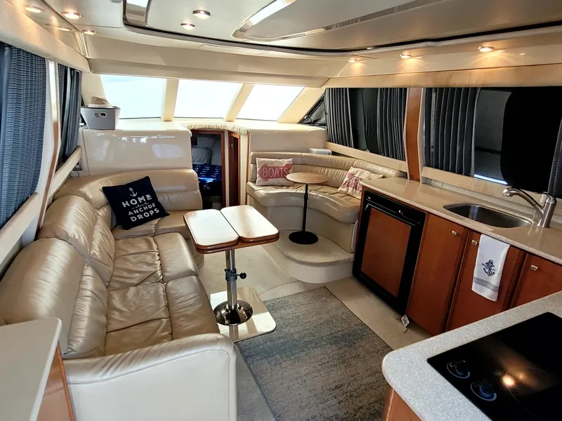 Slide: The Image of Luxurious interior of a 2004 Meridian 341 Sedan yacht with leather seating and kitchenette. - 15