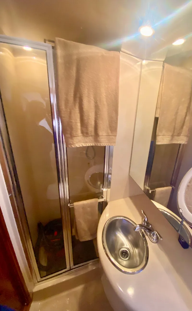 Slide: The Image of Bathroom interior of 2004 Meridian 341 Sedan with shower and sink. - 23