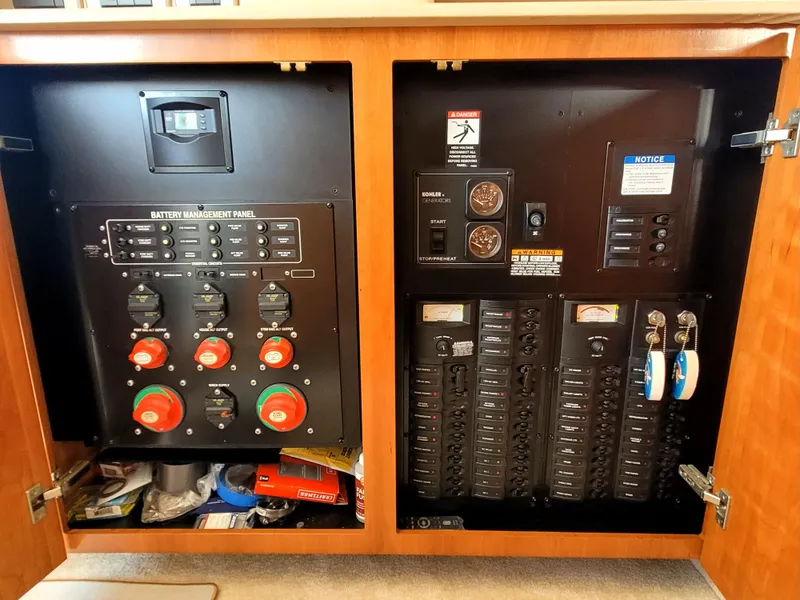 Slide: The Image of Electrical control panel inside a 2004 Meridian 341 Sedan boat, featuring battery management and circuit breakers. - 26