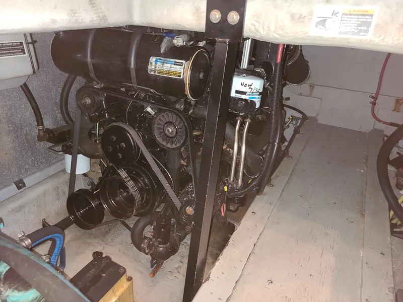 Slide: The Image of Engine compartment of a 2004 Meridian 341 Sedan boat, showcasing mechanical components. - 28