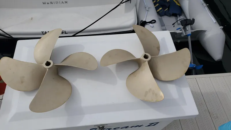 Slide: The Image of Two boat propellers on a dock near a 2004 Meridian 341 Sedan yacht. - 29