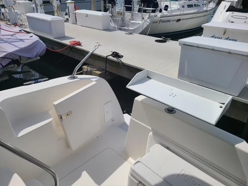 Slide: The Image of 2004 Meridian 341 Sedan boat docked at marina with fishing station. - 9