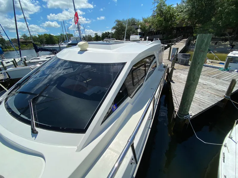 Slide: The Image of Custom Emerald Bay 36 yacht docked at marina, 2018 model. - 12