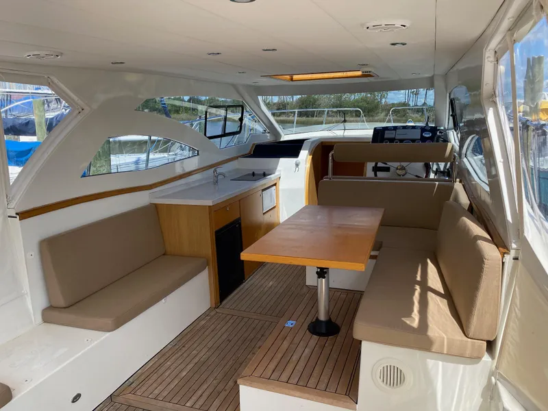Slide: The Image of Interior of 2018 Custom Emerald Bay 36 yacht with seating and dining area. - 14