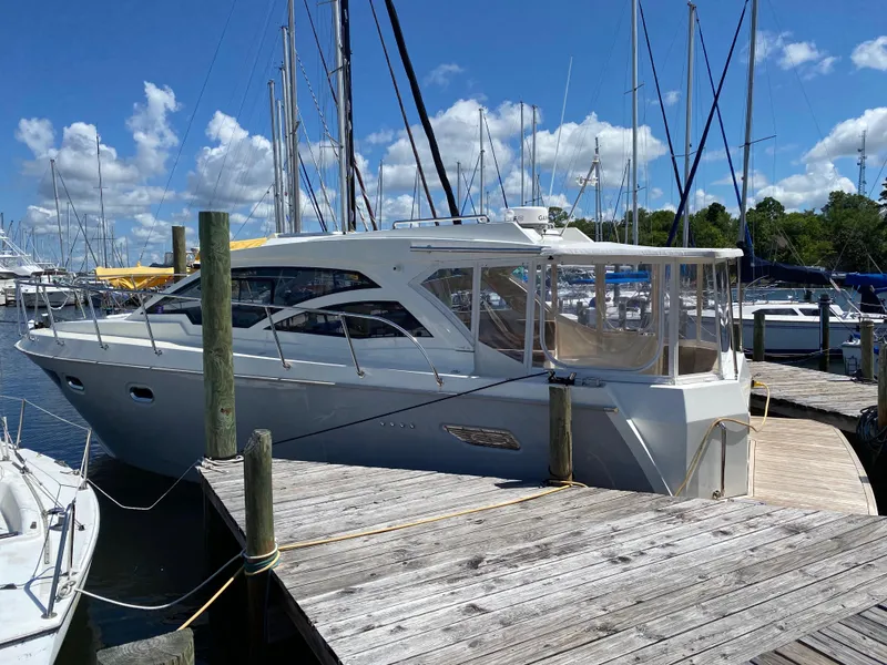 Slide: The Image of Custom Emerald Bay 36 yacht docked at marina, 2018 model. - 2