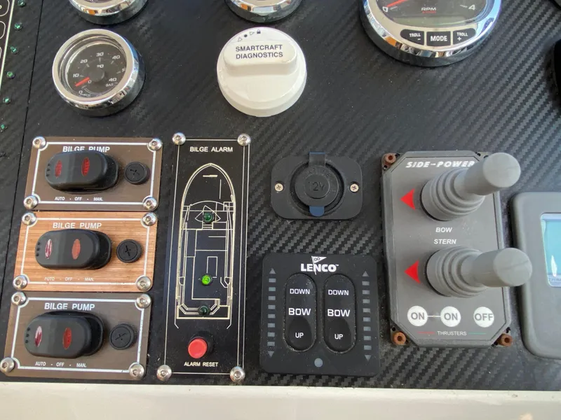 Slide: The Image of Control panel of a 2018 Custom Emerald Bay 36 boat with bilge pump switches and diagnostics. - 26