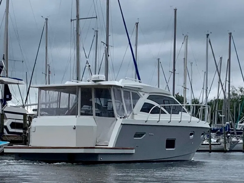 Slide: The Image of Custom Emerald Bay 36 yacht, 2018 model, docked at a marina with sailboats. - 3