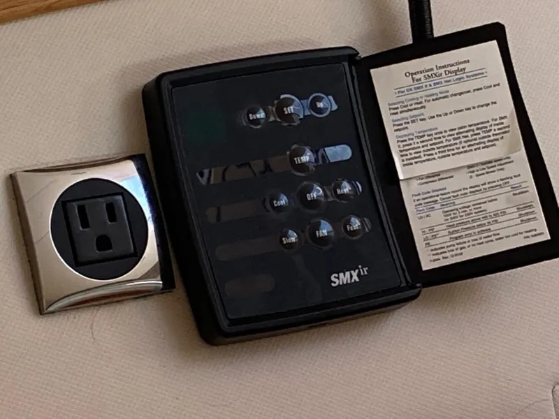 Slide: The Image of Control panel and power outlet on a 2018 Custom Emerald Bay 36 yacht. - 34