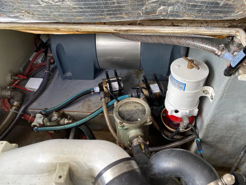 Slide: The Image of Engine compartment of a 2018 Custom Emerald Bay 36 boat showing various mechanical components. - 37
