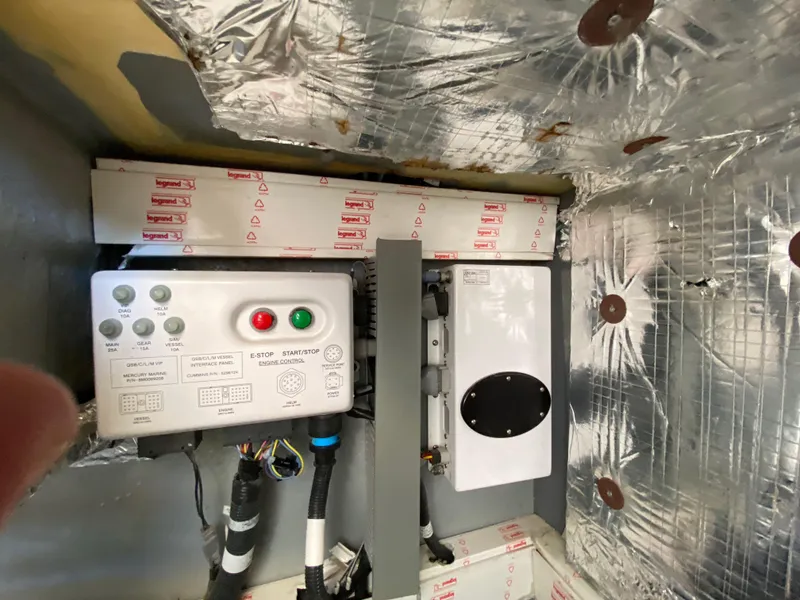 Slide: The Image of Control panel and wiring inside a 2018 Custom Emerald Bay 36 boat. - 41