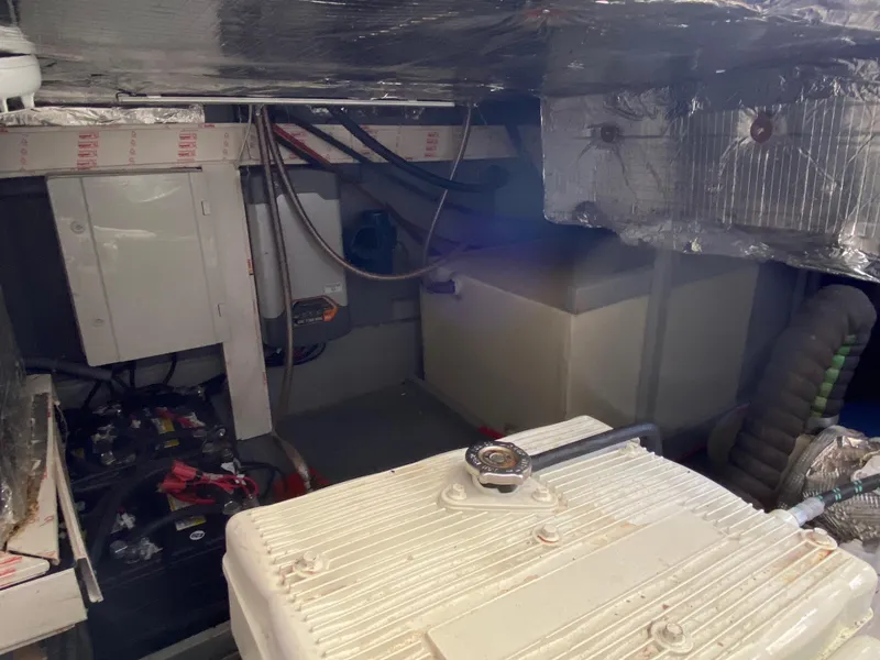 Slide: The Image of Engine room of a 2018 Custom Emerald Bay 36 boat with various equipment. - 42