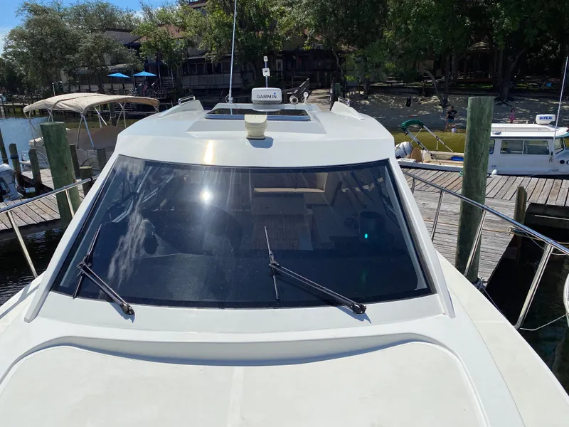 Slide: The Image of Custom Emerald Bay 36 (2018) docked, front view with windshield and wipers. - 8