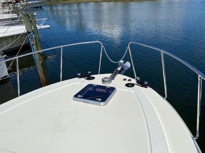 Slide: The Image of Bow of 2018 Custom Emerald Bay 36 yacht docked in a marina. - 9