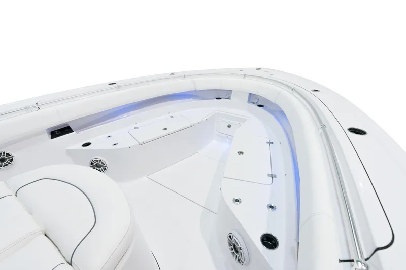Slide: The Image of 2025 Sportsman Open 352 Center Console boat interior with white seating and blue LED lighting. - 14