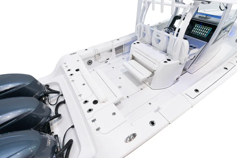 Slide: The Image of 2025 Sportsman Open 352 Center Console boat with triple outboard engines and spacious deck. - 23