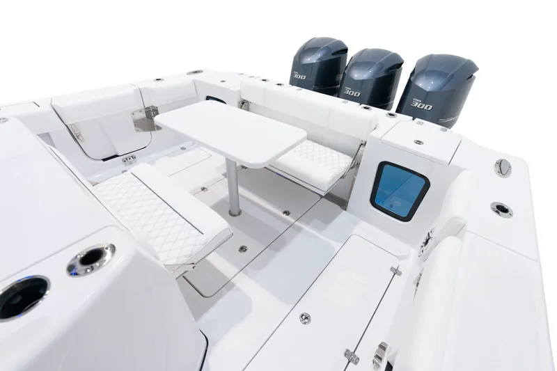 Slide: The Image of 2025 Sportsman Open 352 Center Console boat interior with seating and table. - 24