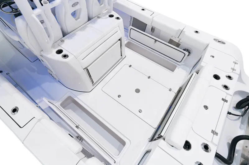 Slide: The Image of 2025 Sportsman Open 352 Center Console boat interior with seating and storage compartments. - 26