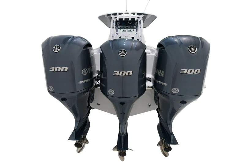 Slide: The Image of 2025 Sportsman Open 352 Center Console with triple Yamaha 300 outboard engines. - 4