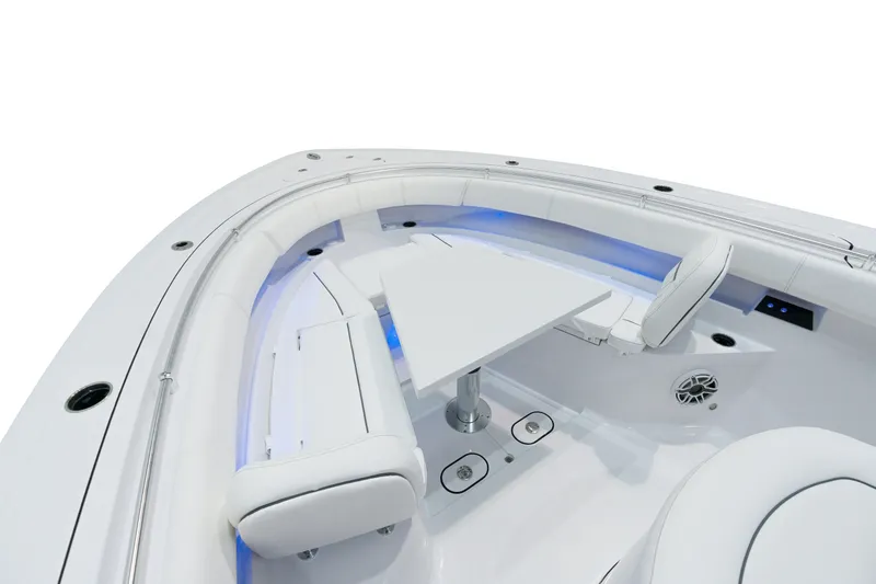 Slide: The Image of 2025 Sportsman Open 352 Center Console boat interior with seating and table. - 9