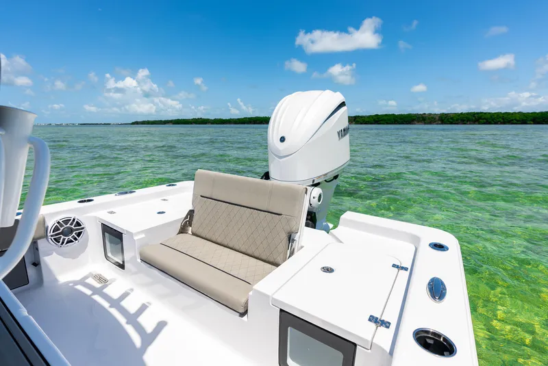 Slide: The Image of 2024 Sportsman Masters 247 Bay Boat on clear water with blue sky. - 11