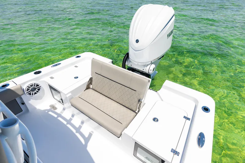 Slide: The Image of 2024 Sportsman Masters 247 Bay Boat with outboard motor on clear water. - 13
