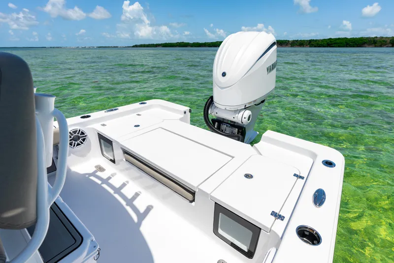 Slide: The Image of 2024 Sportsman Masters 247 Bay Boat on clear water. - 14