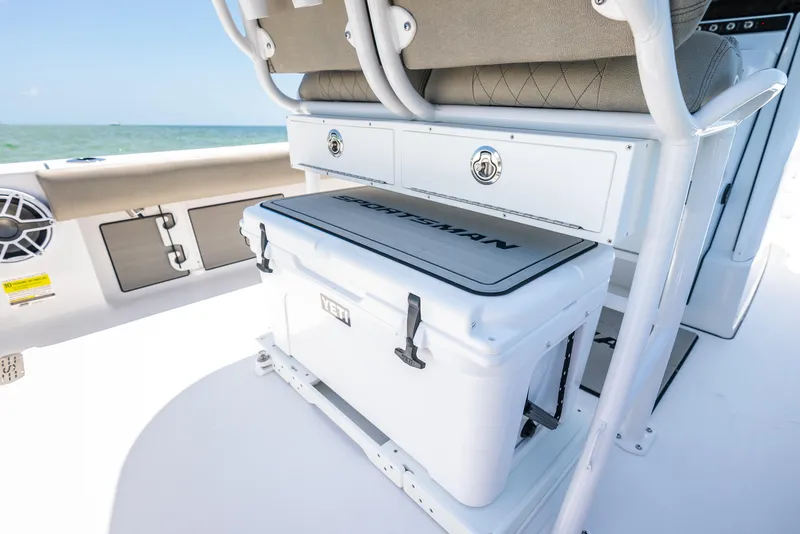 Slide: The Image of 2024 Sportsman Masters 247 Bay Boat interior with storage and cooler. - 16