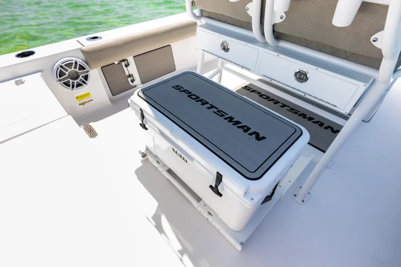 Slide: The Image of 2024 Sportsman Masters 247 Bay Boat deck with cooler and storage. - 17