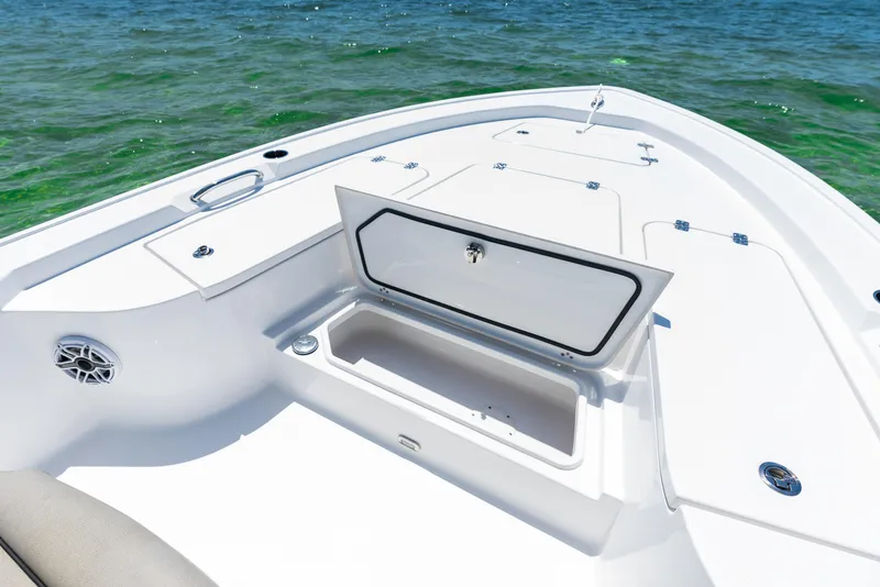 Slide: The Image of 2024 Sportsman Masters 247 Bay Boat bow storage compartment. - 2