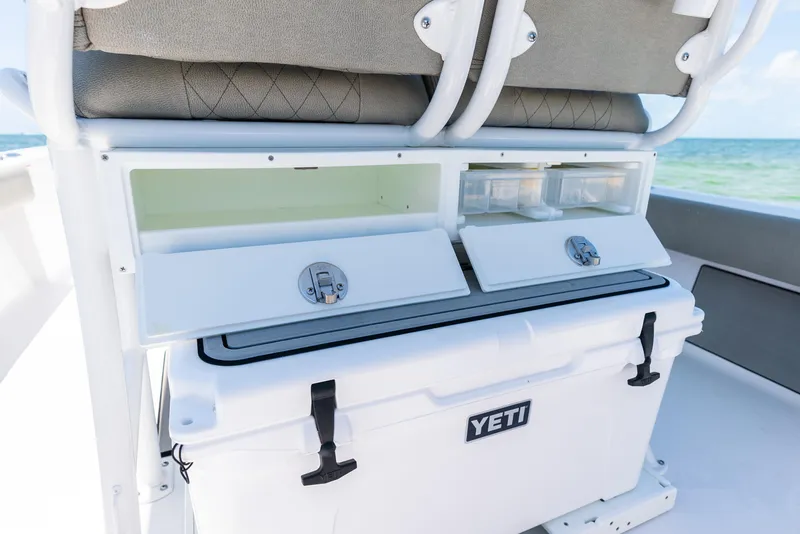 Slide: The Image of 2024 Sportsman Masters 247 Bay Boat with Yeti cooler and storage compartments. - 20