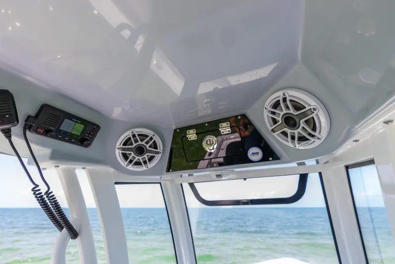 Slide: The Image of 2024 Sportsman Masters 247 Bay Boat interior with speakers and control panel. - 23