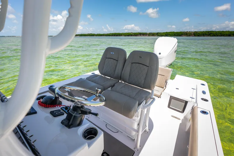 Slide: The Image of 2024 Sportsman Masters 247 Bay Boat on clear water. - 8