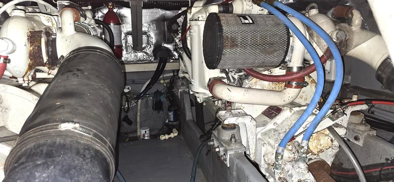 Slide: The Image of Engine room of a 1992 Sea Ray 400 Express Cruiser with visible machinery and components. - 8