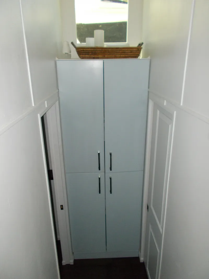 Slide: The Image of 1992 Jamestowner Silver Lining houseboat docked at a marina with scenic background. - 15