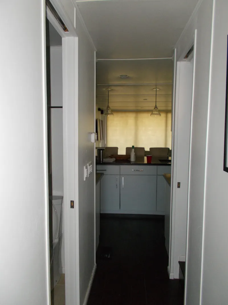 Slide: The Image of Modern kitchen area on a 1992 Jamestowner Silver Lining houseboat. - 18