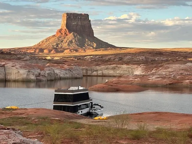 Slide: The Image of Narrow hallway in a 1992 Jamestowner Silver Lining houseboat with motivational wall decor. - 3