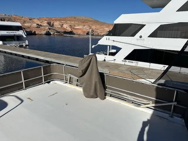 Slide: The Image of Cozy bedroom in 1992 Jamestowner Silver Lining houseboat with modern white decor. - 9