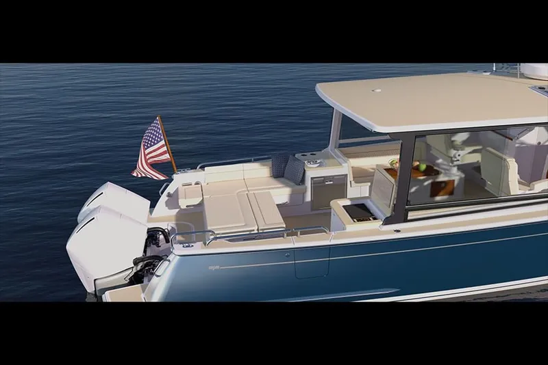 Slide: The Image of 2023 MJM 3 boat with American flag on calm water. - 7