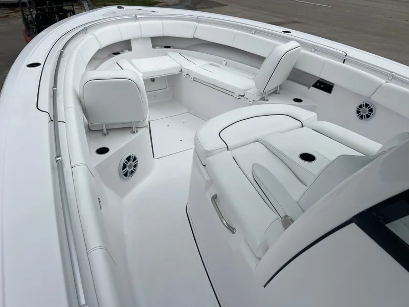 Slide: The Image of 2024 Sportsman Open 352 boat interior with white seating and modern design. - 10