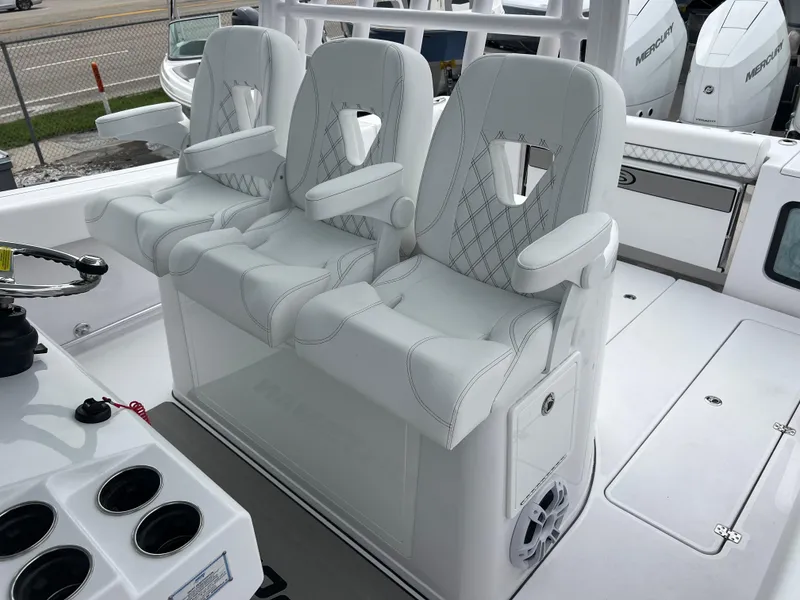 Slide: The Image of 2024 Sportsman Open 352 boat with luxurious white seating and armrests. - 13