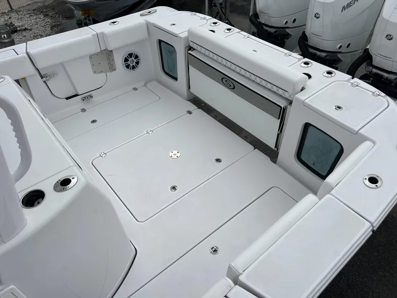 Slide: The Image of 2024 Sportsman Open 352 boat deck with storage compartments and seating. - 14