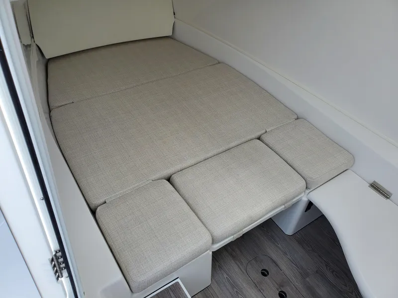 Slide: The Image of 2024 Sportsman Open 352 cabin interior with cushioned sleeping area. - 17