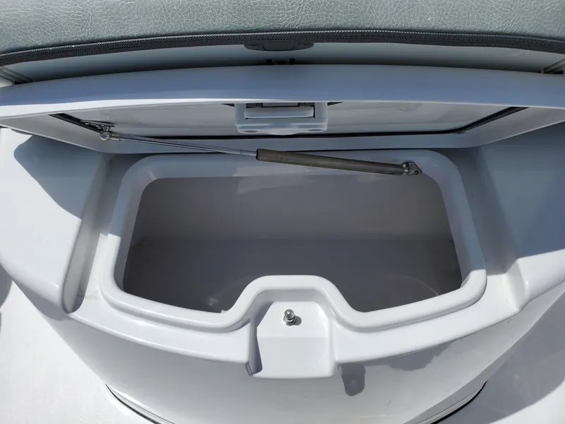 Slide: The Image of 2024 Sportsman Open 352 storage compartment with open lid. - 20