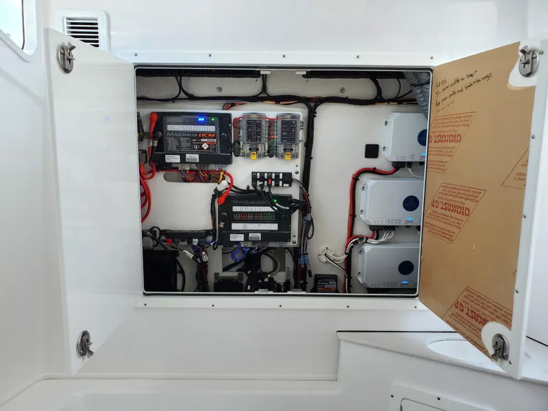 Slide: The Image of Electrical panel inside a 2024 Sportsman Open 352 boat. - 21