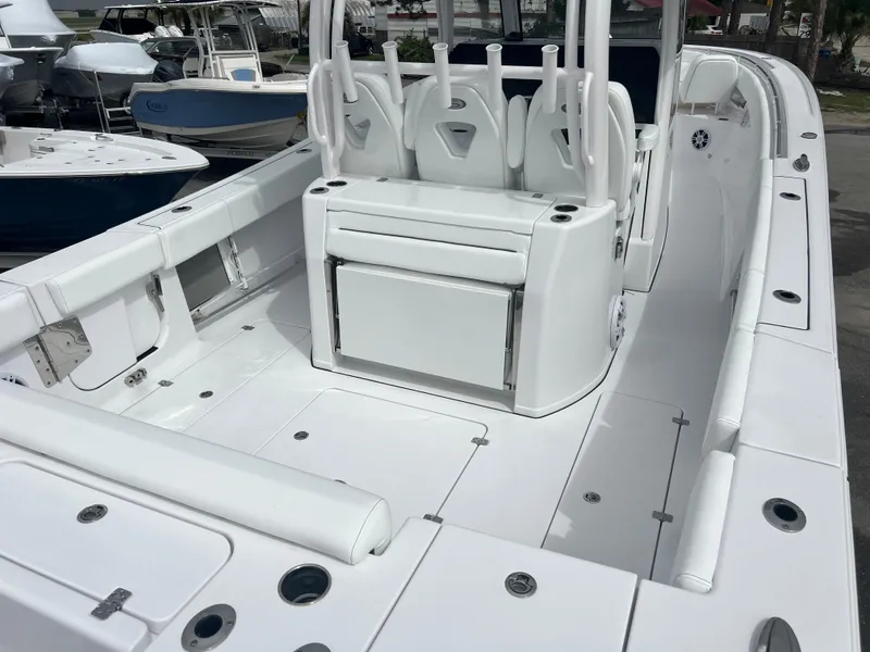 Slide: The Image of 2024 Sportsman Open 352 boat interior with seating and storage compartments. - 5