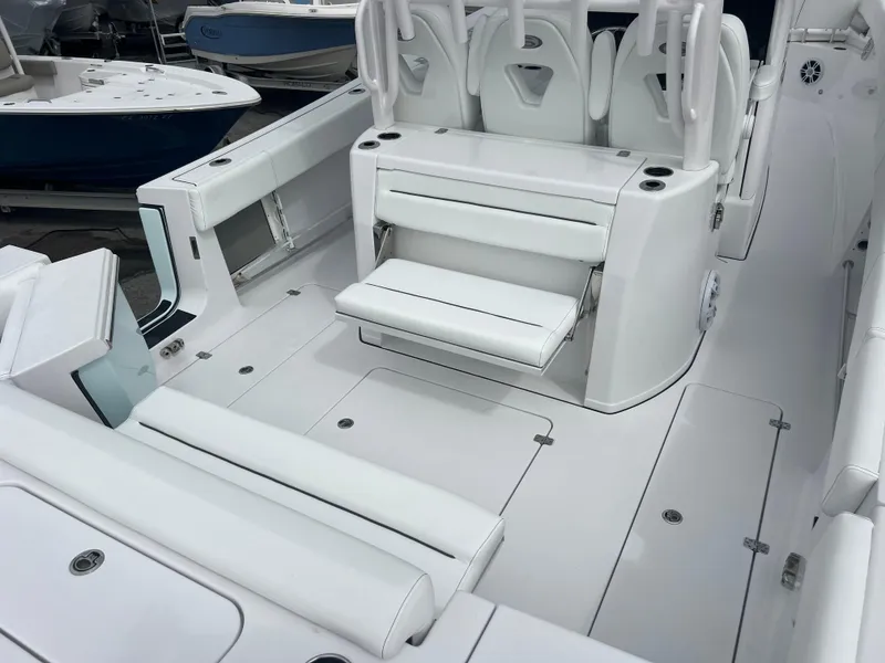Slide: The Image of 2024 Sportsman Open 352 boat interior with white seating and modern design. - 6