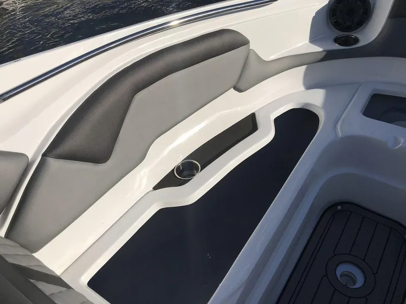 Slide: The Image of Interior seating of 2020 Rinker 29QX BR boat with cup holder and speaker. - 13