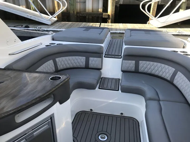 Slide: The Image of 2020 Rinker 29QX BR boat with spacious seating and modern interior design. - 17